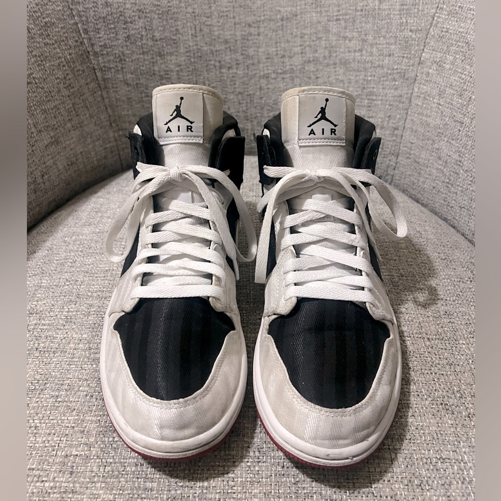 Nike Women’s Air Jordan Size 9.5 in Black and White high top canvas.